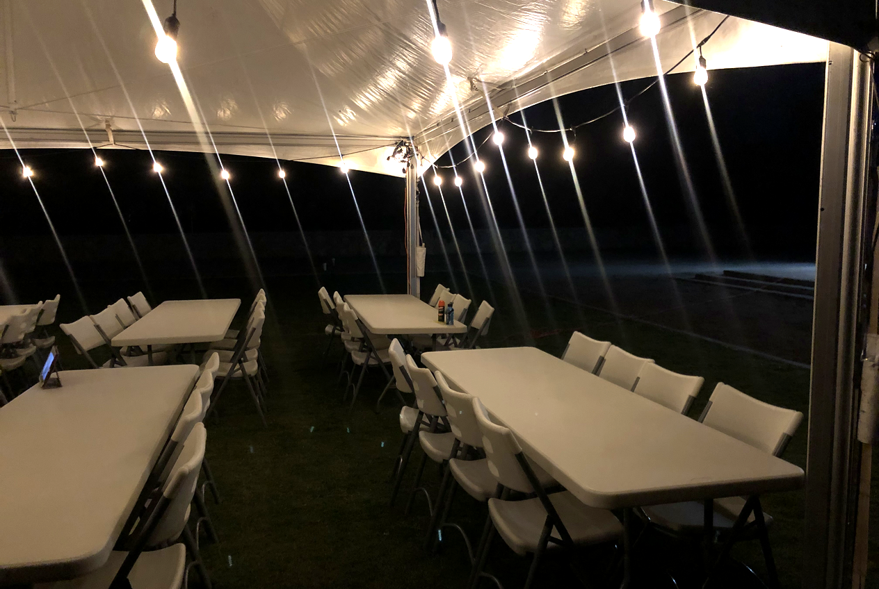 Backyard party setup with string lights in Las Cruces